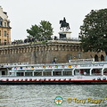 River boat going under Pont Neuf