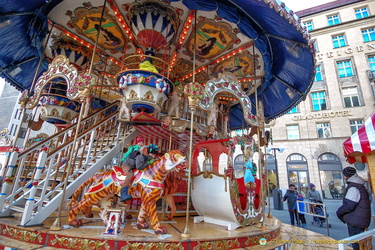 Children enjoying carousel rides