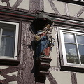 Timber-frame house with status of Mary with baby Jesus