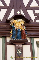 1581 wooden house with statues including Christ as a child