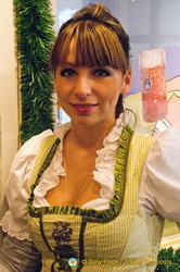 A pretty waitress in traditional dirndl