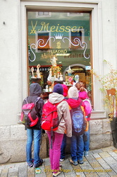 Some very young shoppers admiring the Meissen and Lladró porcelain