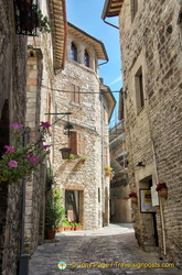 Medieval cobbled street leading to Rocca Maggiore