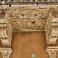 Decorative stonework under the balcony