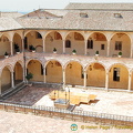 Courtyard of the Sacro Convento friary with 53 Romanesque arches