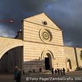 The exterior of the building consists of alternate strips of pink and white stone, with massive supporting arches on either side