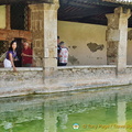Checking the water of Bagno Vignoni
