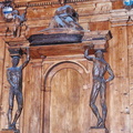 The Cattedra del Lettore (teacher's desk) is flanked by two statues of Spellati (skinned men).