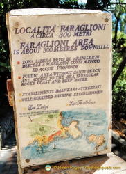 Sign indicating 300m to the Faraglioni Rocks