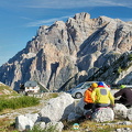 Three travellers checking their bearings on Passo Valparola