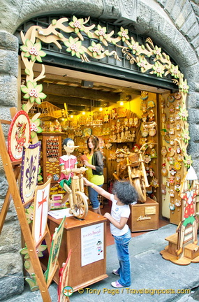 Little kid taken by Pinocchio on his bike