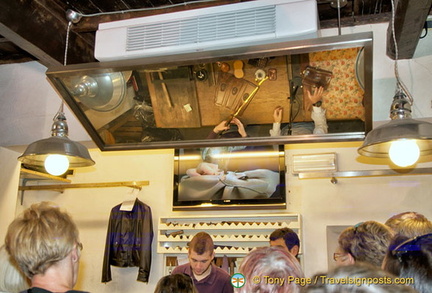 A leather demonstration viewed from the overhead mirror