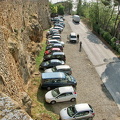 Cars parked outside Pienza historic city walls