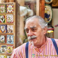 A distinguish-looking Siena shopkeeper