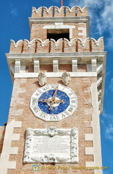 Arsenale tower with a blue-faced clock