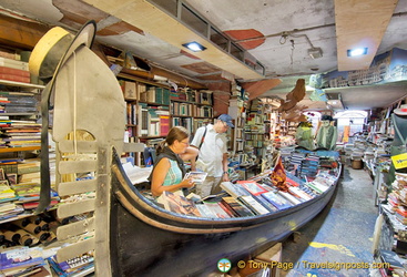 The gondola loaded with books reminds visitors that they are in Venice