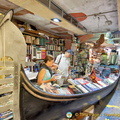 The gondola loaded with books reminds visitors that they are in Venice