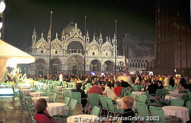 Crowds enjoying drinks and music in Piazza San Marco