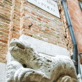 Lion bearing a human head above the entrance of Chiesa San Polo