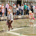 These two elderly ladies don't mind walking in the water