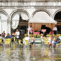 Waiters decked in gumboots continue to serve Aperol Spritz 