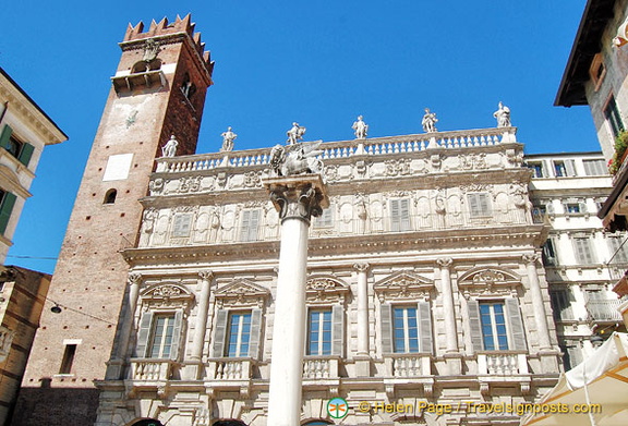 Palazzo Maffei at the northern end of Piazza Erbe with Gardello Tower on its left