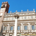 Palazzo Maffei at the northern end of Piazza Erbe with Gardello Tower on its left