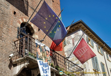 EU flag and the 'scala' emblem of the Scaligeri