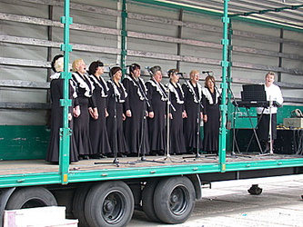 Choral group performing from a mobile stage
