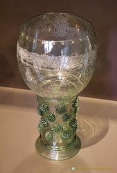 The roemer, an ovoid tumbler reminiscent of our current wine glasses, was fashionable during the 16th century. The stem is decorated with raspberry-shaped prunts.