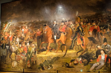 The Battle of Waterloo is the largest painting in the Rijksmuseum. The central figure in black cloak is the Duke of Wellington