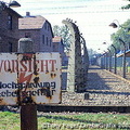 A camp fence sign warning against high voltage