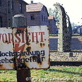 A camp fence sign warning against high voltage