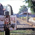 A camp fence sign warning against high voltage