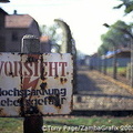 A camp fence sign warning against high voltage