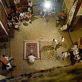 Tourists entertained by a carpet merchant in the Fez medina