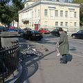 An elderly man feeding the birds