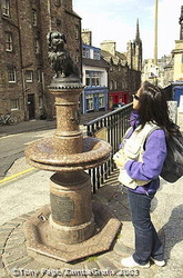 Greyfriars Bobby - a little Skye terrier sitting on an old drinking fountain near the gateway to Greyfriars Church [Greyfriars