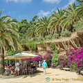 The viaduct is covered by palm trees and other vegetation to create a mix between nature and architecture