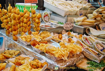 Freshly cooked fish and chips and other seafood at La Boqueria