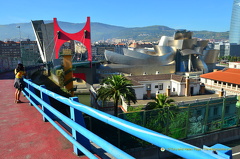 The Guggenheim tower, the Red Arches and the Guggenheim Bilbao set against Mt Artxanda