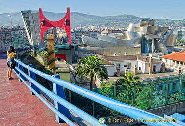 The Guggenheim tower, the Red Arches and the Guggenheim Bilbao set against Mt Artxanda