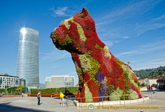 Guggenheim Museum: Puppy in a beautiful coat of flowers which is watered by an internal system