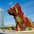 Guggenheim Museum: Puppy in a beautiful coat of flowers which is watered by an internal system