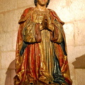 Sacristy Museum: The praying statue of King Ferdinand next to the Passion Altarpiece