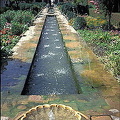 The Patio de la Acequia is an enclosed oriental garden built round a long central pool   