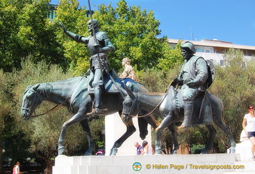 Don Quixote with Sancho Panza trotting along