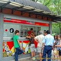 Tourists buying their Madrid sightseeing tour