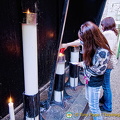 Offerings of candles by the faithful