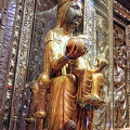 The Black Madonna's wooden orb protrudes through the glass for pilgrims to touch